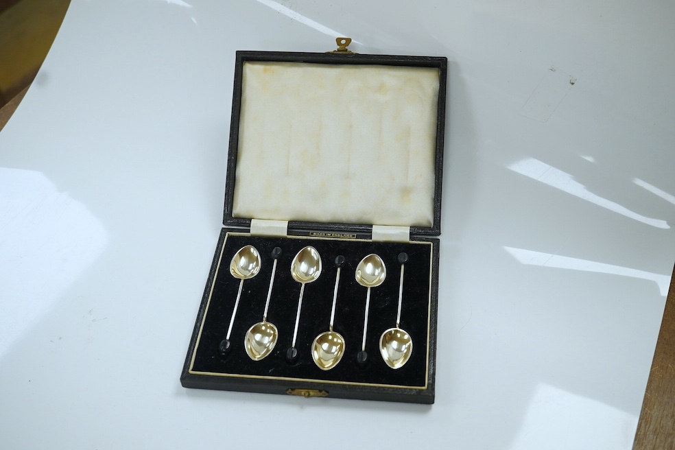 Five assorted cased silver sets including pair of horseshoe napkin rings, six bean end coffee spoons, two christening sets and a small serving spoon. Condition - fair